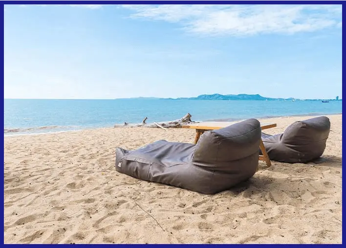 bean bags with waterproof covers present on a beach
