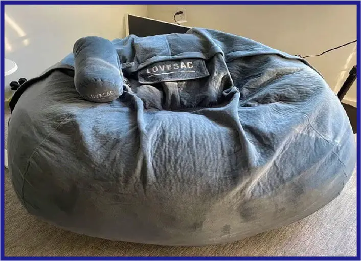lovesac bean bag with a blue fabric cover on it